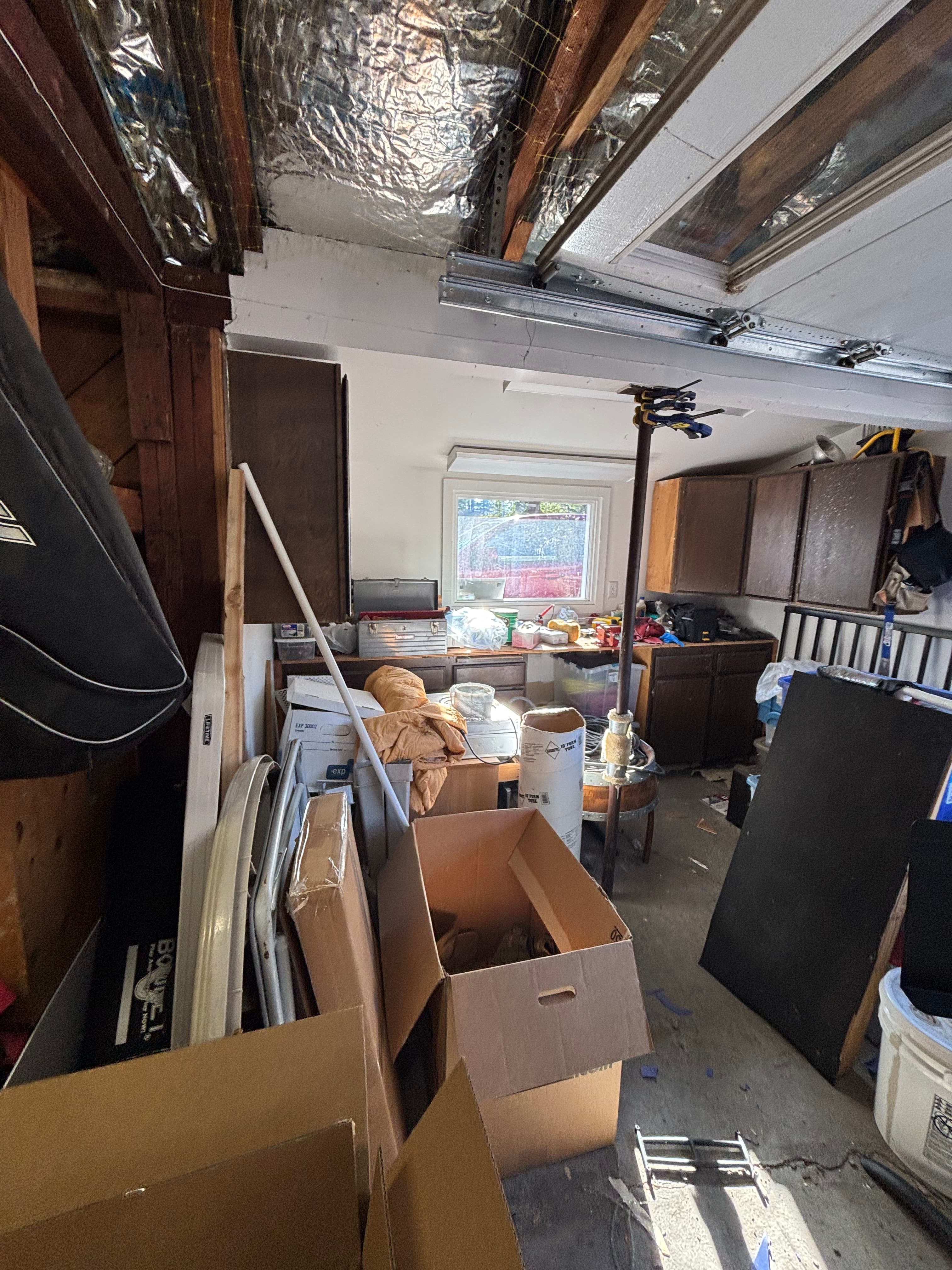 Overwhelmed person staring at garage